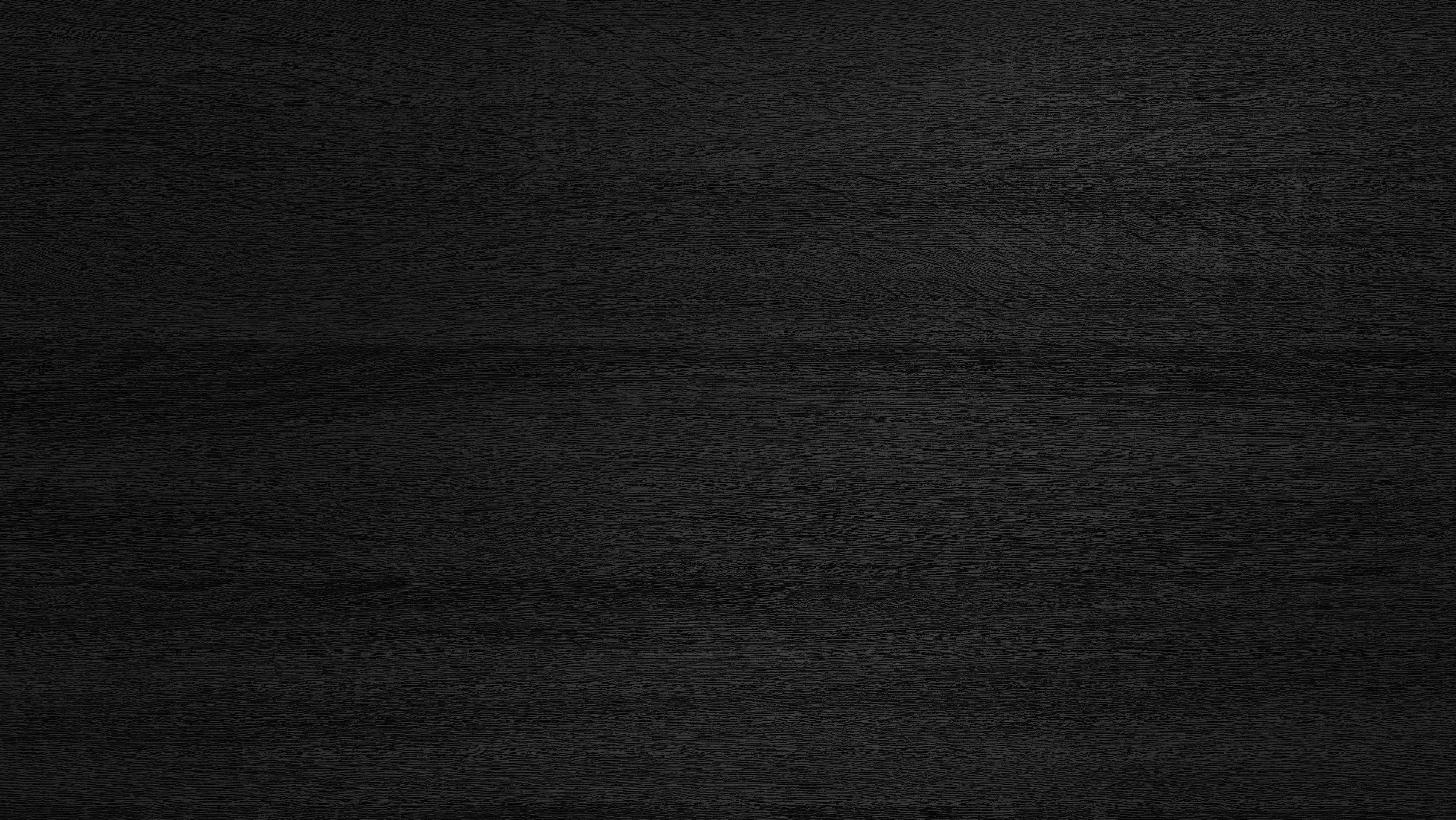 dark black melamine wood texture use as background.