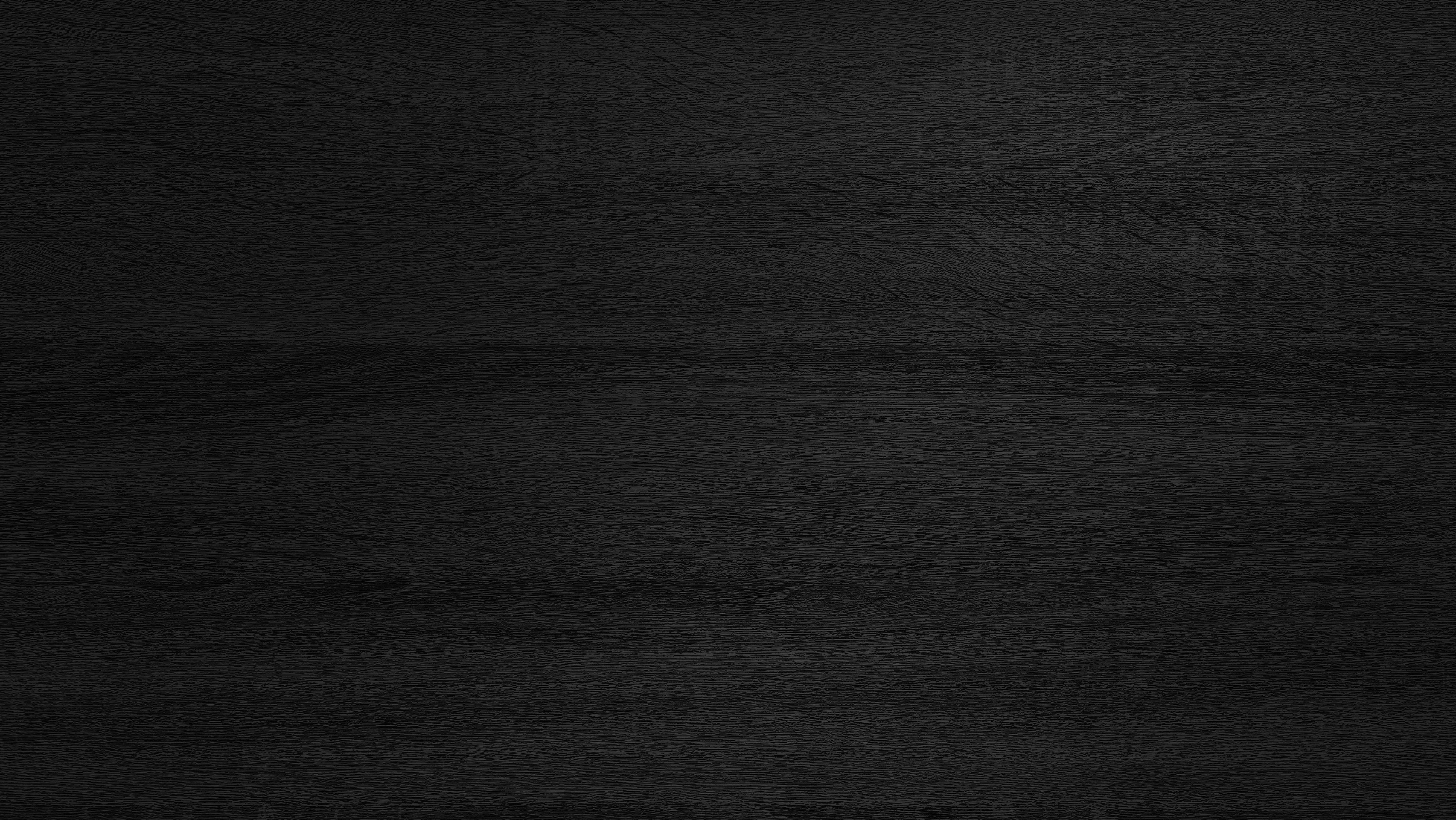 dark black melamine wood texture use as background.