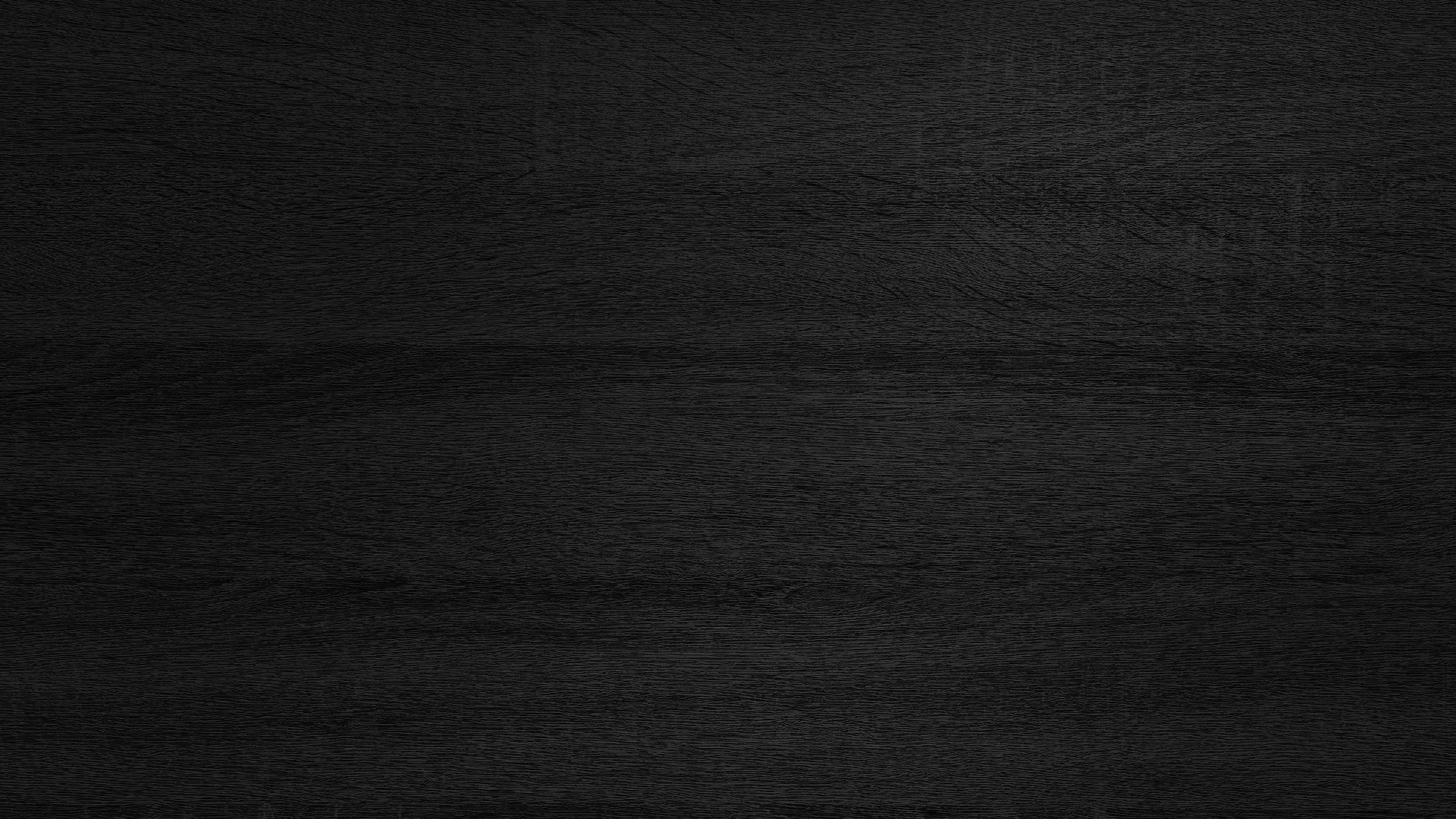 dark black melamine wood texture use as background.